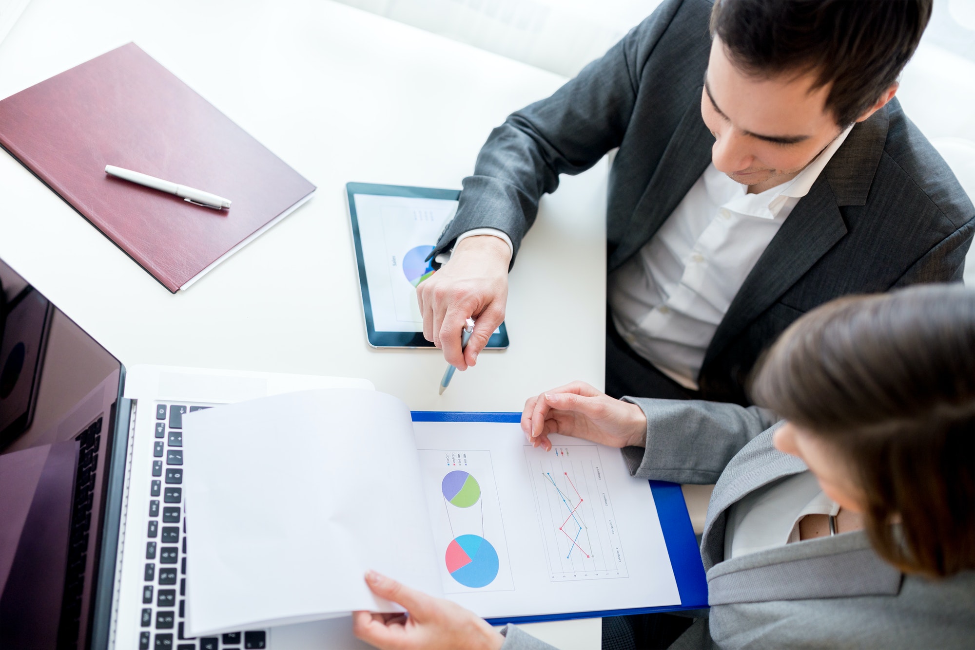 business-people-reviewing-business-documents.jpg