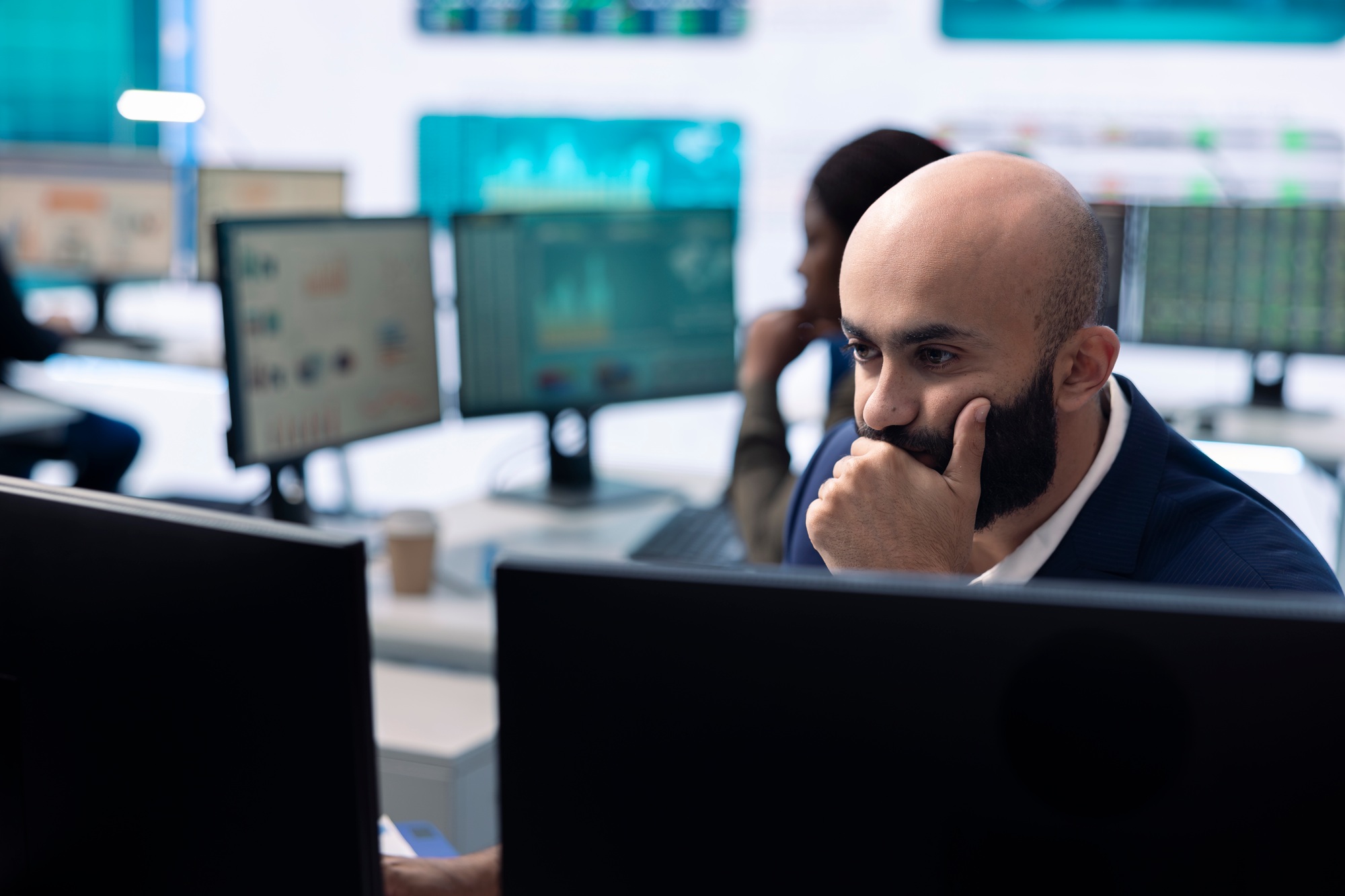 Enterprise manager looking into project updates and details in monitoring room
