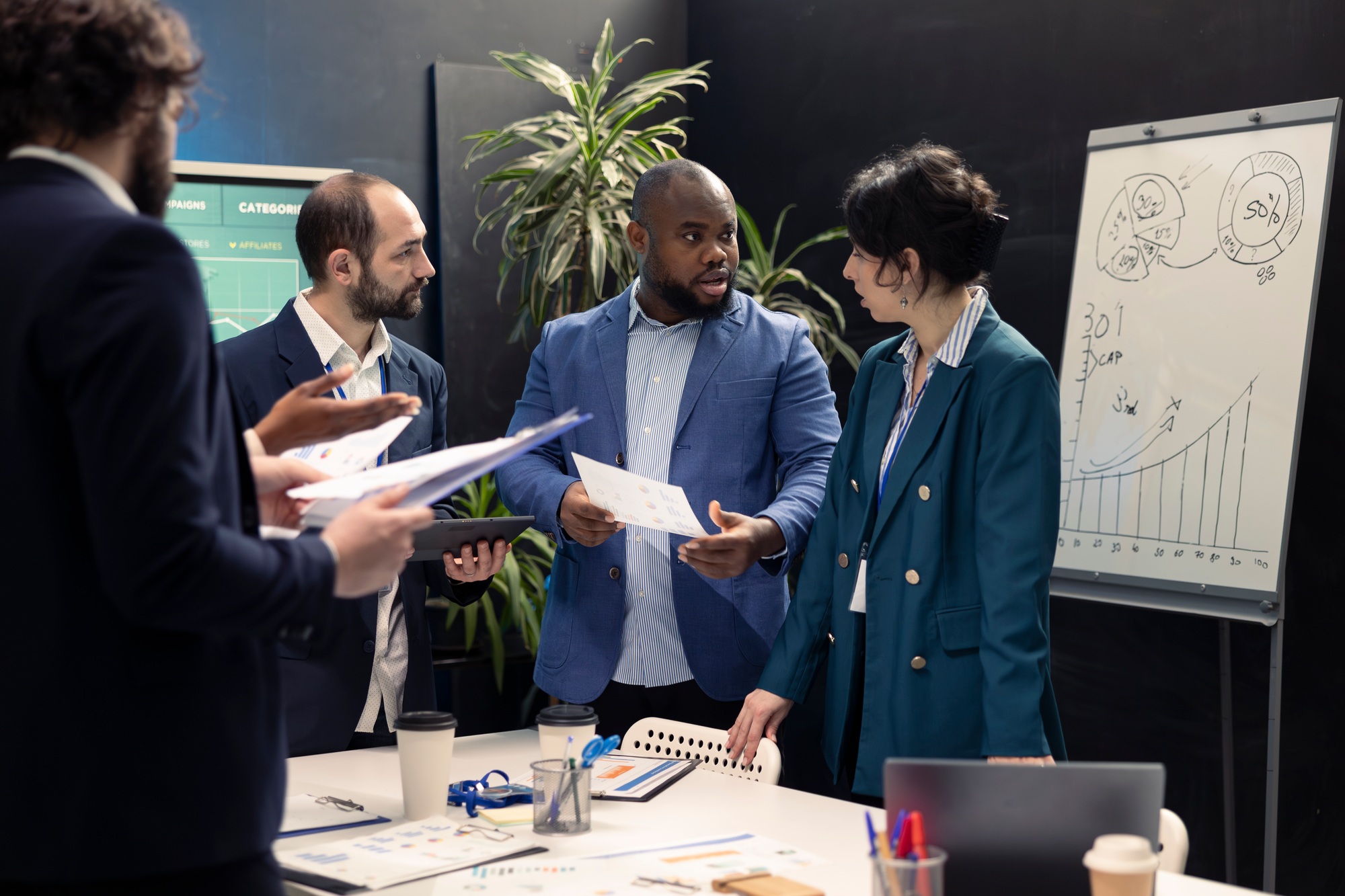 Enterprise workmates looking into project updates and details