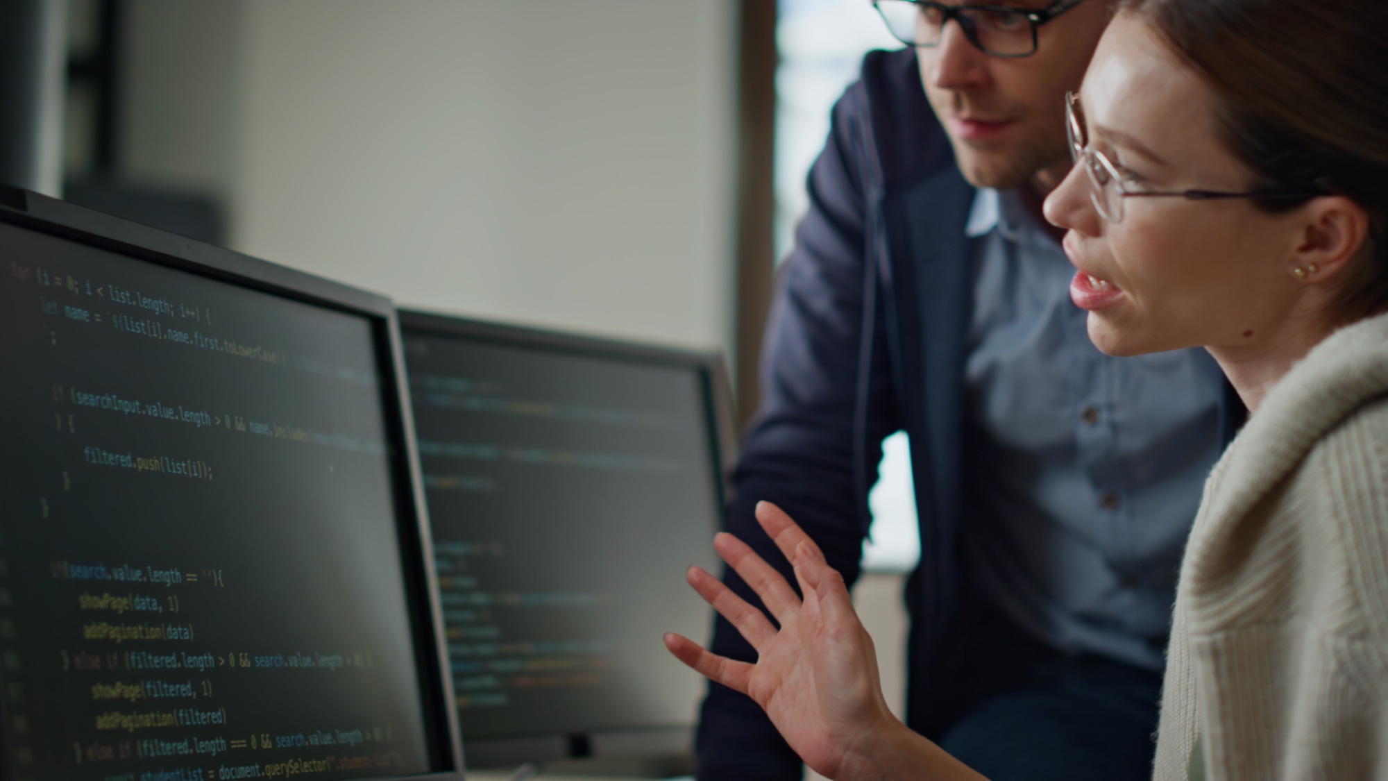 Software team consulting office closeup. It engineer supervisor teaching intern Software team consulting office closeup. It engineer supervisor teaching intern